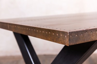 dudley-x-frame-dining-table-copper-top-close-up